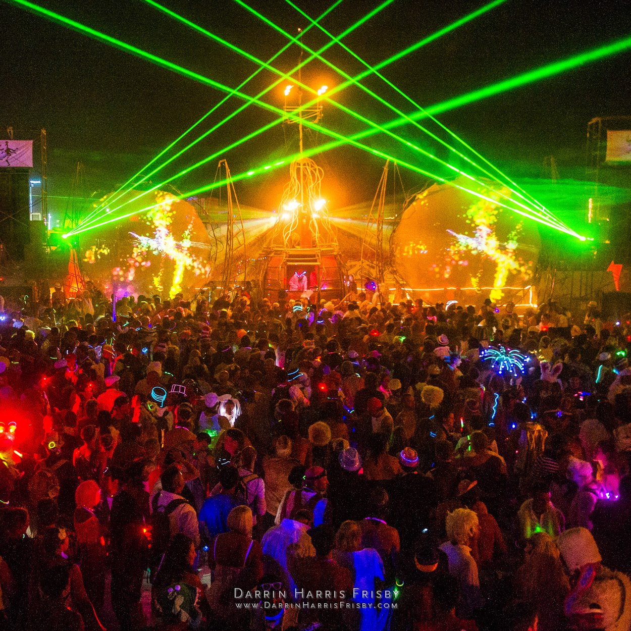 Opulent Temple crowd beneath crossed green lasers at Burning Man 2012